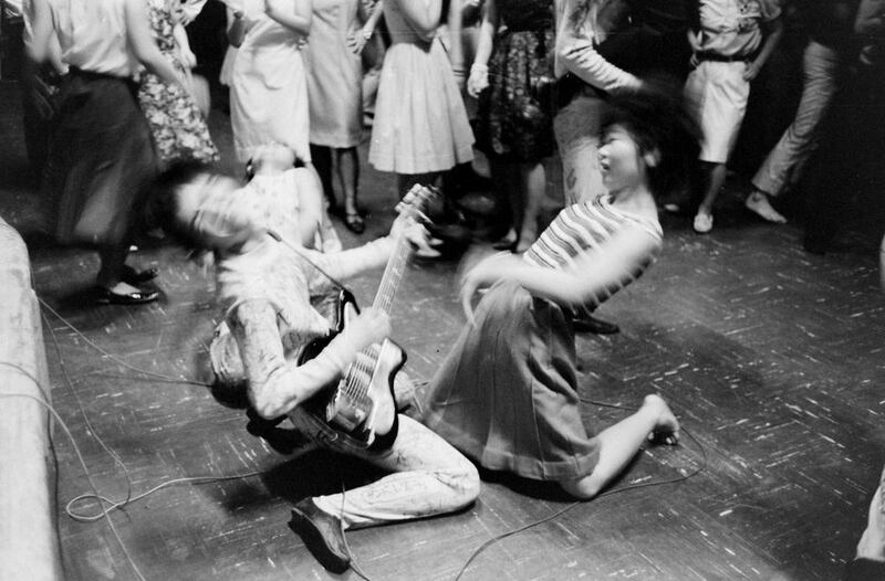 She loves you yeah yeah yeah: a teenage girl dances with a member of the Tokyo Beatles, a Beatles cover band, during a performance in Tokyo in 1964. Getty Images