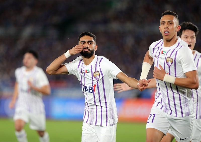 Mohammed Abbas of Al Ain celebrates with teammate Soufiane Rahimi after scoring their opening goal against Yokohama F Marinos. Chris Whiteoak / The National
