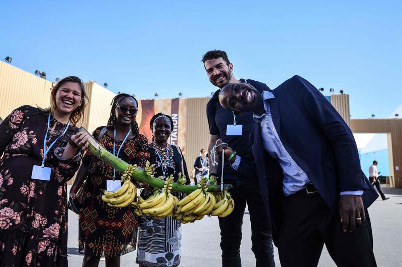 Australian climate activists offer bananas to climate summit participants. AFP