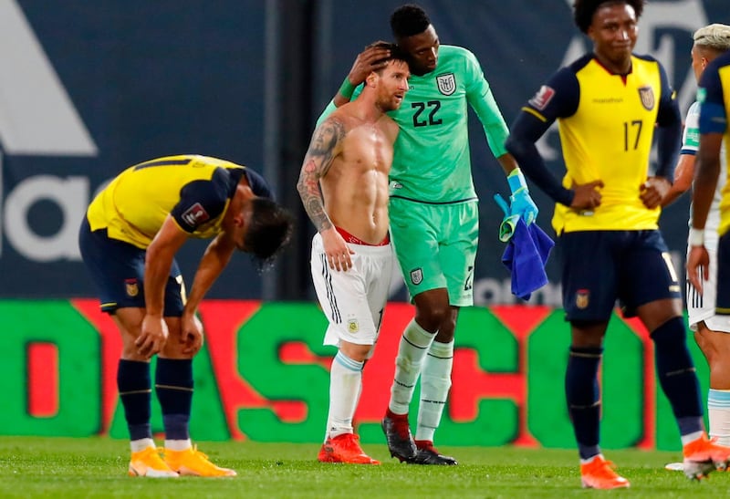 Ecuador's goalkeeper Alexander Dominguez  and Argentina's Lionel Messi at the end of their World Cup 2022 qualifier. AFP