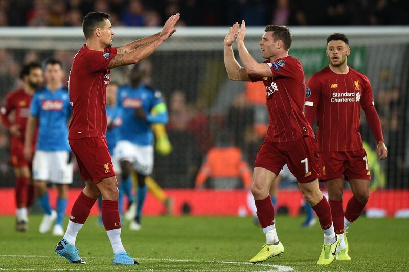 Dejan Lovren (L) celebrates his goal. AFP