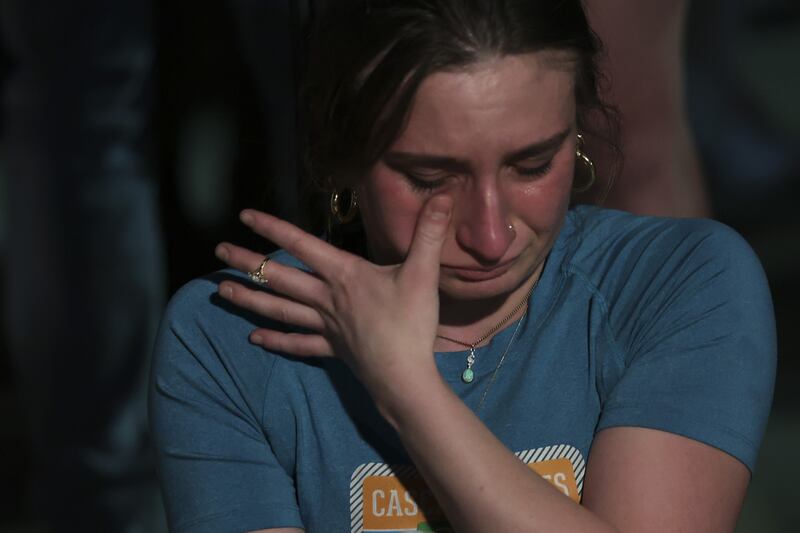 A woman cries during the protests. AFP