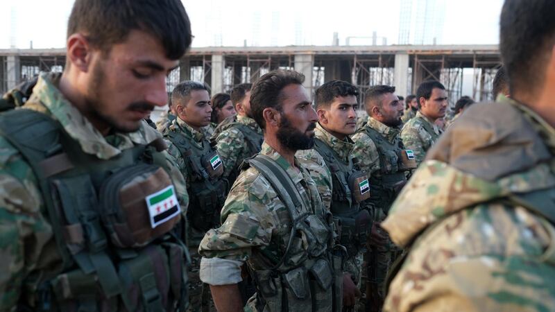 Turkey-backed members of Syrian National Army prepare for moving to Turkey for an expected military operation by Turkey into Kurdish areas of northern Syria, in Azas near Turkey border, Syria.  US President Donald J. Trump announced the withdrawal of US troops from the area ahead of the anticipated action by Turkish President Recep Tayyip Erdogan.  EPA