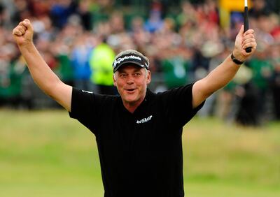 Darren Clarke of Northern Ireland celebrates on the 18th green after winning the British Open at Royal St George's in 2011. Reuters