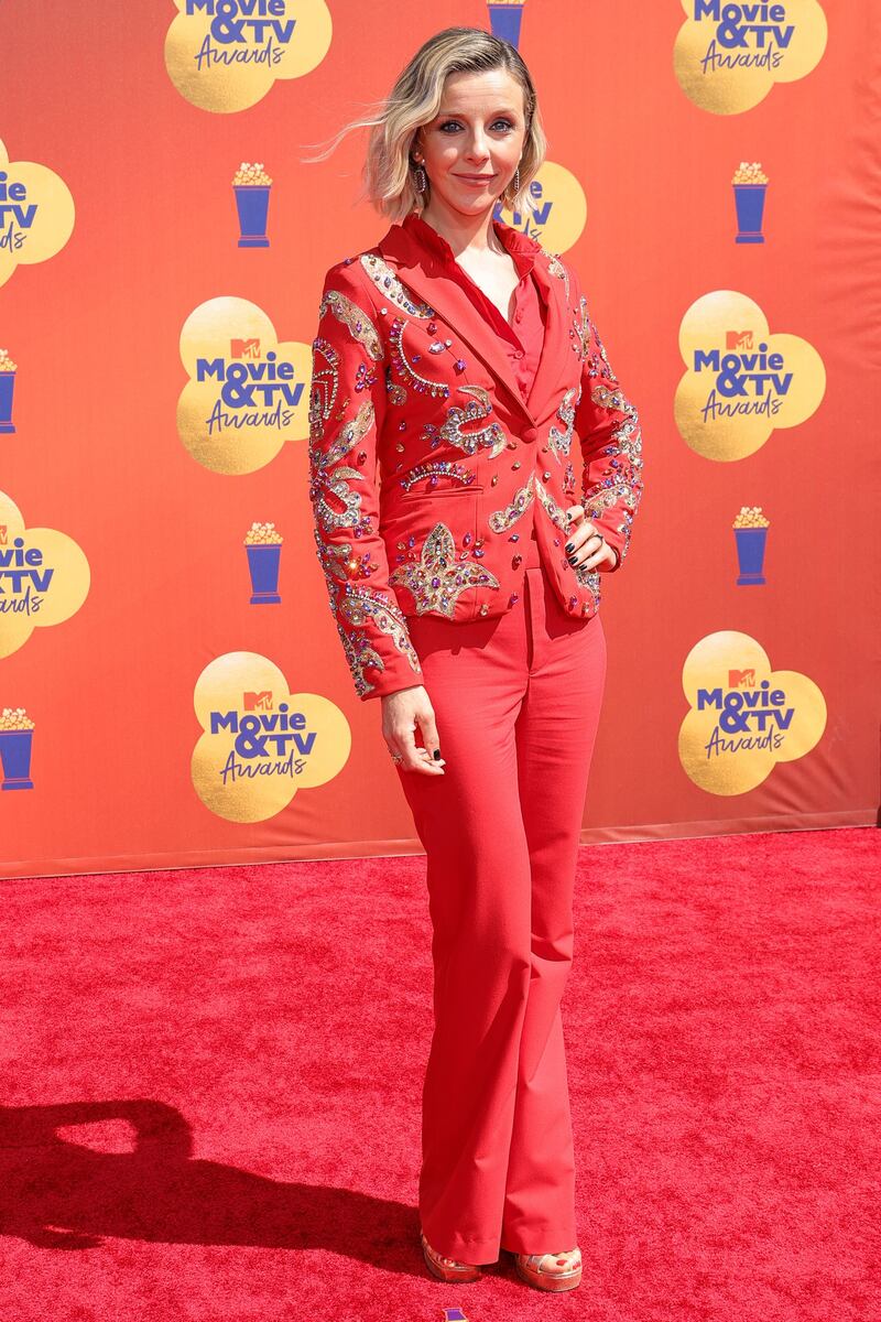 Sophia Di Martino in an embellished red suit. AFP