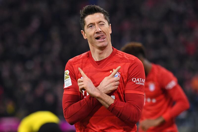 Bayern Munich's Polish forward Robert Lewandowski celebrates scoring the opening goal during the German first division Bundesliga football match FC Bayern Munich vs BVB Borussia Dortmund in Munich, southern Germany, on November 9, 2019. Germany OUT
 / AFP / dpa / Sven Hoppe
