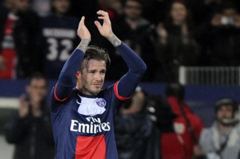 David Beckham bid farewell to football in Paris with the Beatles song 'Hello Goodbye' in the background. Fred Dufour / AFP