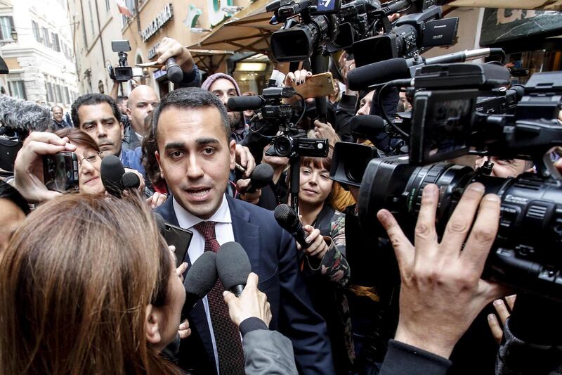 epa06741655 Italy's Five-Star Movement (M5S) leader Luigi Di Maio (C-L) is surrounded by the media as he leaves the parliament's Lower House in Rome, Italy, 16 May 2018. Luigi Di Maio said that he and 'League' party chief Matteo Salvini were willing to be outside the government team if this was necessary to make a M5S-League executive possible. 'I hope that I can be involved in the government to put myself personally to the test, but if necessary, I and Salvini are ready to be outside,' Di Maio told reporters.  EPA/GIUSEPPE LAMI