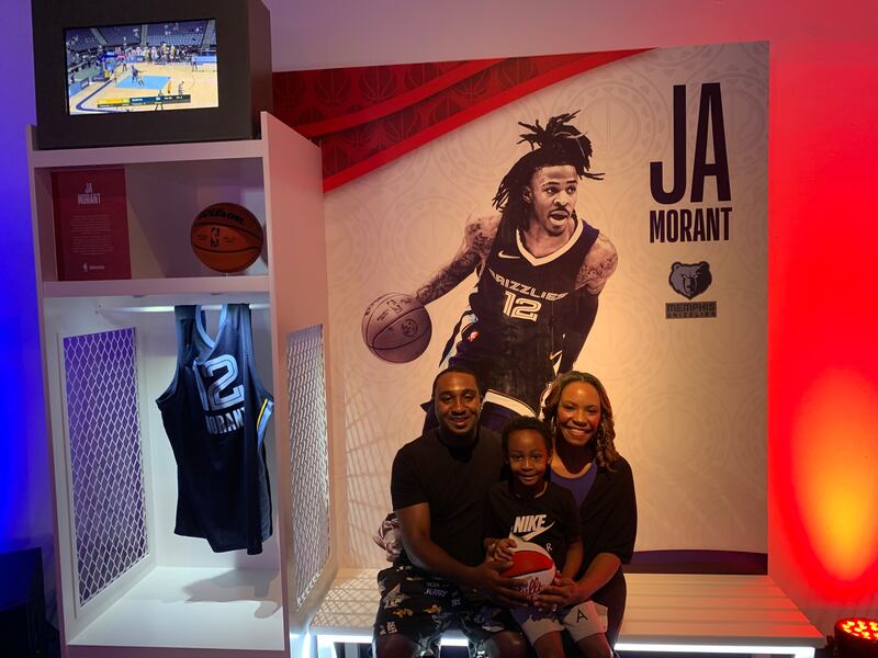 Zack Rawlings, his wife Auriel and son Colin from the US at NBA District. Rawlings says he is 'Abu Dhabi ready' for the NBA. Evelyn Lau / The National