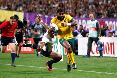 Australia's Marika Koroibete, who was born in Fiji, scores their sixth try during Saturday's 39-21 victory for the Wallabies. Reuters