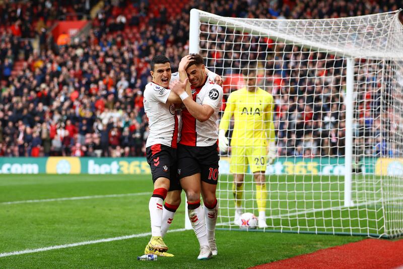 Che Adams celebrates with Mohamed Elyounoussi after scoring Southampton's equaliser. Getty