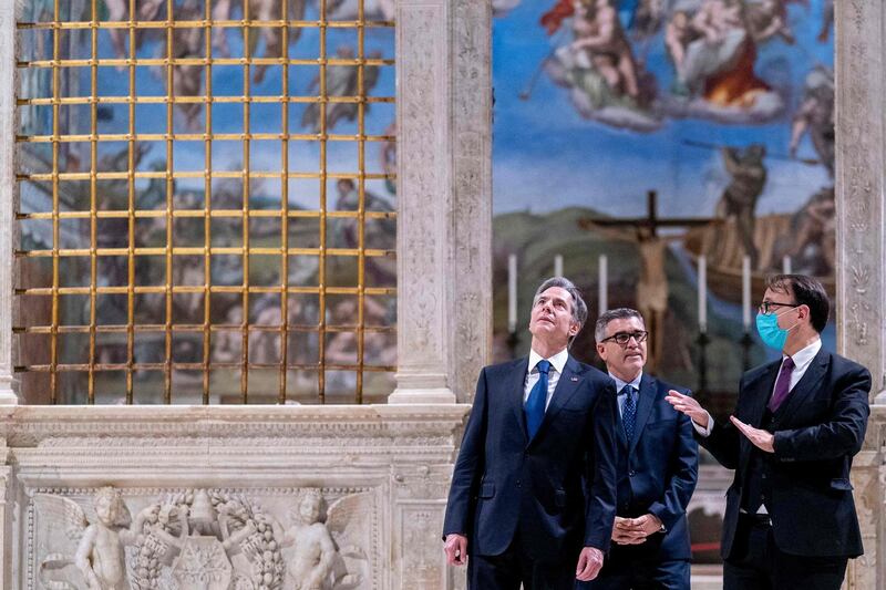 US Secretary of State Antony Blinken and Charge d'Affaires of the US Embassy to the Holy See Patrick Connell visit, with tour guide Alessandro Conforti, the Sistine Chapel, in the Apostolic Palace, at the Vatican, ahead of a meeting with Pope Francis and Archbishop Paul Gallagher, as part of a three-nation tour of Europe. AFP