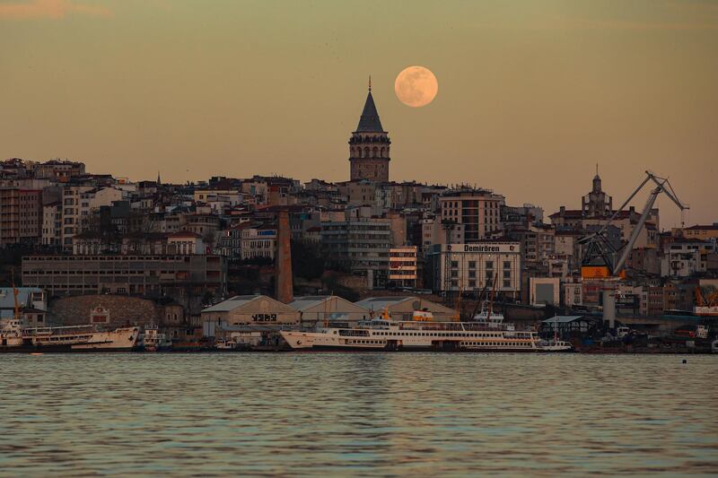 A view of the Golden Horn, with a full pink supermoon rising behind Istanbul's iconic Galata Tower. AP Photo