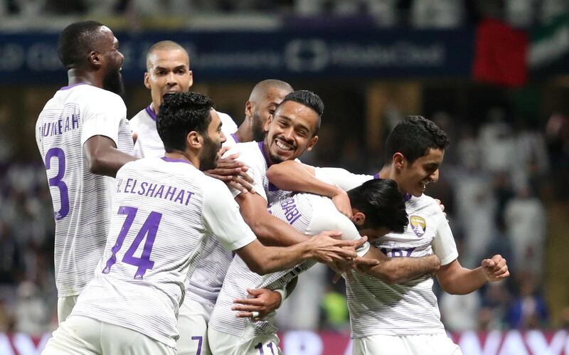 Al Ain's Bandar Al Ahbabi celebrates scoring their third goal with Rayan Yaslem and teammates. Reuters