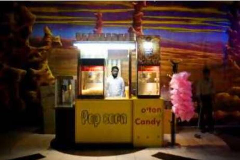 Sharjah - May 26, 2008:  Ligesh KP, 24, moved to Sharjah from Kerala, India, 5th months ago and has been working at the popcorn stand in Safeer Mall's "Space City" for 40 days. Lauren Lancaster / The National