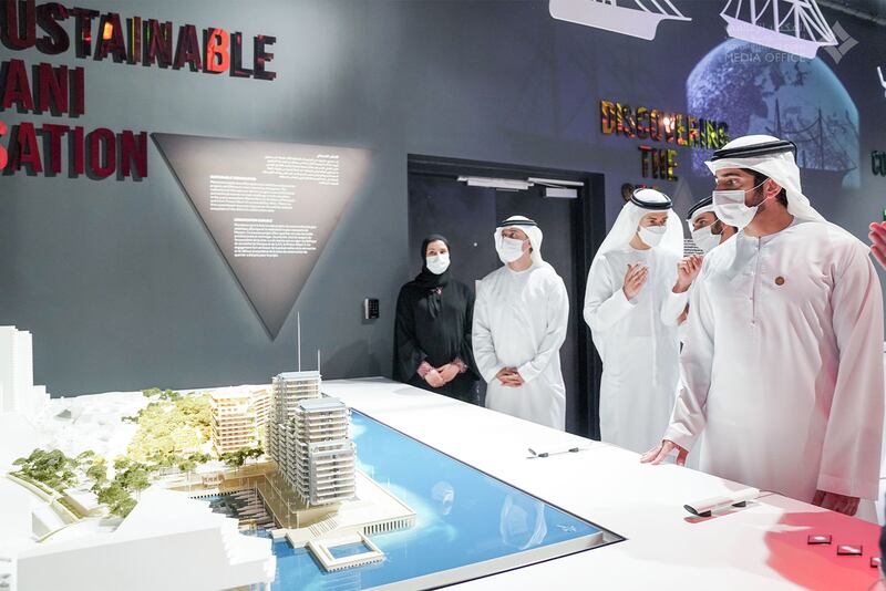 Sheikh Hamdan examines one of the exhibits at the Monaco pavilion.