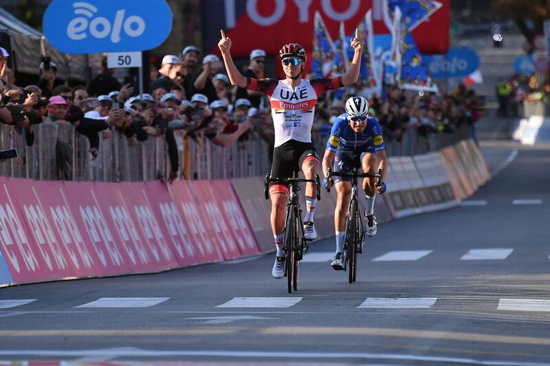 Team UAE Emirates' Tadej Pogacar of Slovenia celebrates as he crosses the finish line to win the Giro di Lombardia. AFP