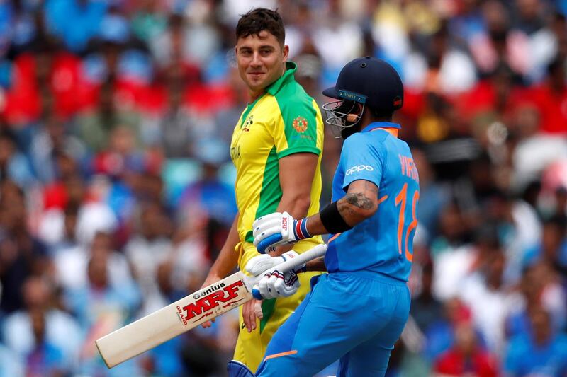 Cricket - ICC Cricket World Cup - India v Australia - The Oval, London, Britain - June 9, 2019    Australia's Marcus Stoinis and India's Virat Kohli    Action Images via Reuters/Andrew Boyers