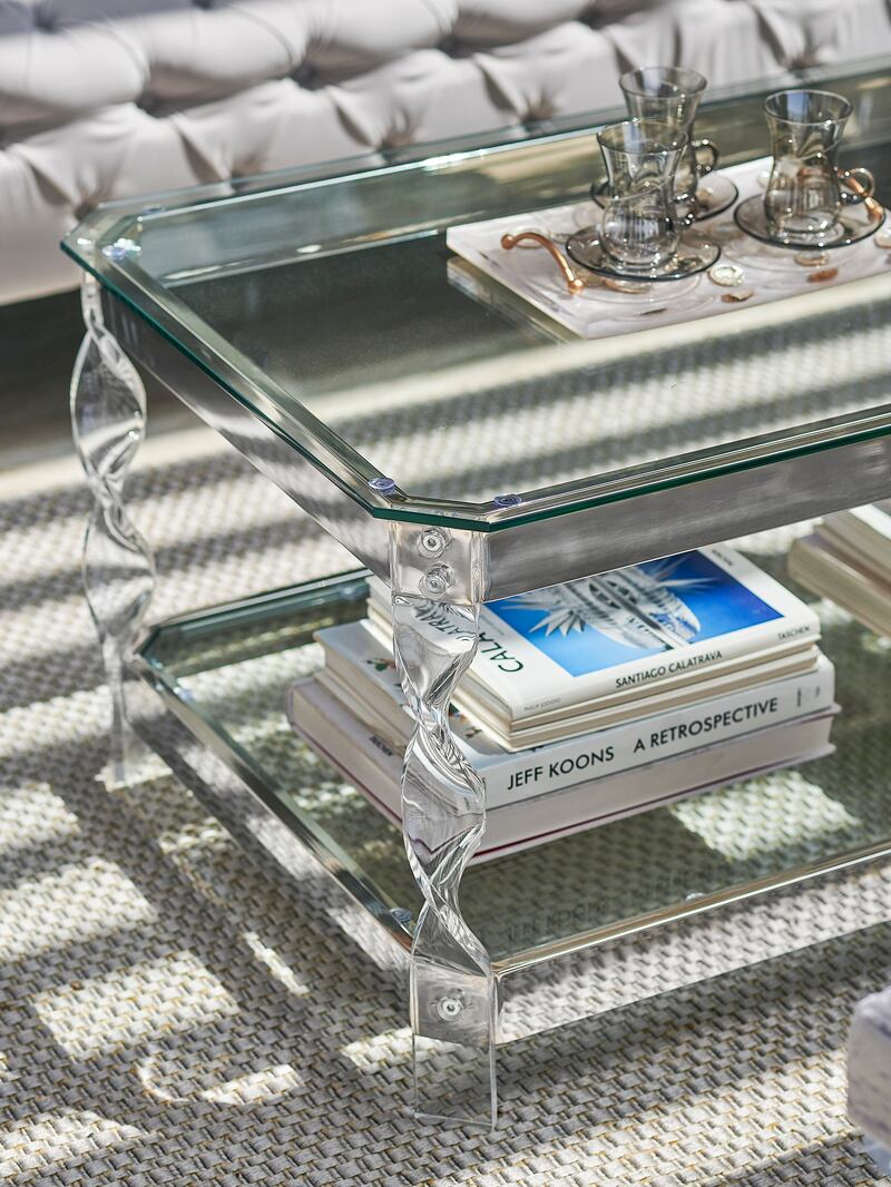 Glass-top and shadow-box coffee tables allow you to display books and other accessories, but opt for safety glass where you can. Photo: Aura