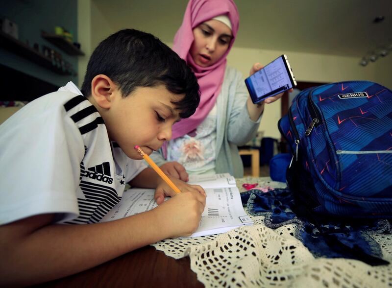 A boy studies online from home as schools close to prevent the spread of Covid-19 in Sidon, Lebanon. Reuters