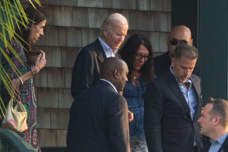 Mr Biden with son Hunter. AP