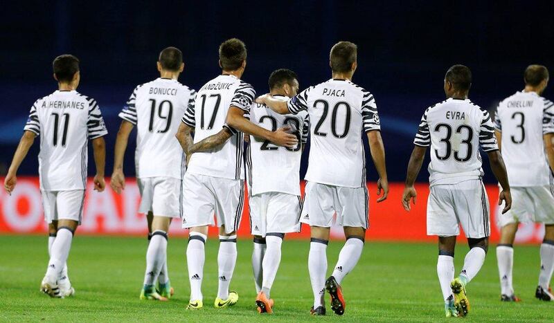 Juventus’ players celebrate after the match against Dinamo Zagreb. Antonio Bronic / Reuters
