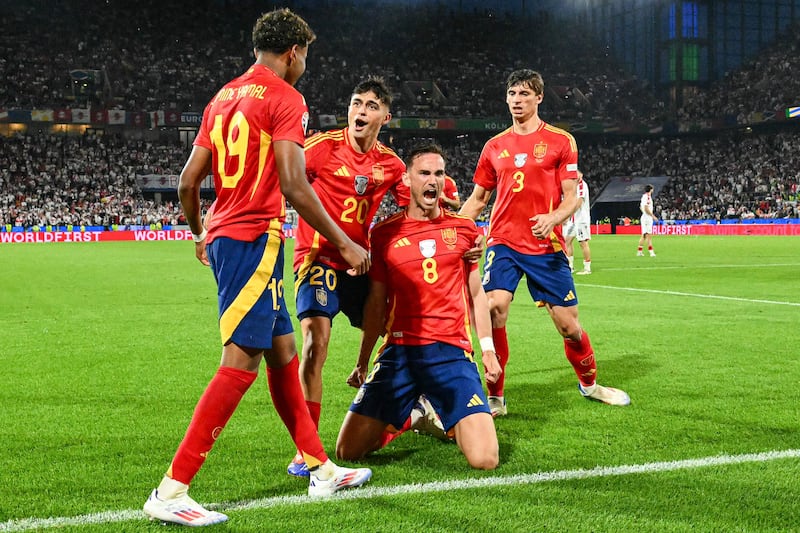 Spain's Fabian Ruiz celebrates with teammates after scoring his team's second goal. AFP
