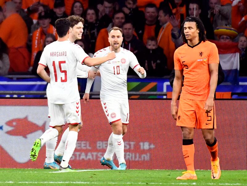 Christian Eriksen celebrates with teammates after scoring for Denmark against the Netherlands. Reuters