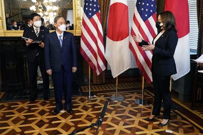 U.S. Vice President Kamala Harris, right, speaks while Yoshihide Suga, Japan's prime minister, second left, listens during a meeting in the Vice President's Ceremonial Office in Washington, D.C., U.S., on Friday, April 16, 2021. President Biden's effort to harness U.S. alliances in Asia to counter China will get a test run during his summit with Suga on Friday -- his first in-person meeting with a foreign leader since taking office. Photographer: Chris Kleponis/CNP/Bloomberg