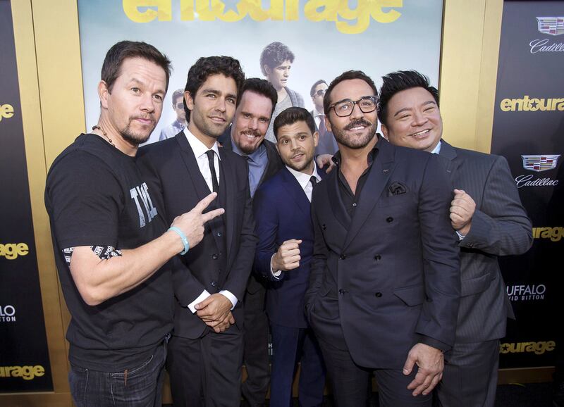 Producer Mark Wahlberg poses with cast members Adrian Grenier, Kevin Dillon, Jerry Ferrara, Jeremy Piven and Rex Lee at the movie premiere of Entourage. Reuters