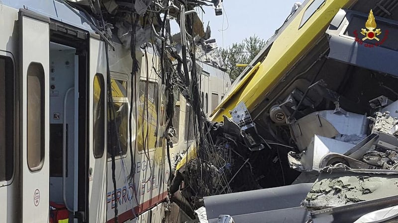 Crumpled wagon cars after the collision. Italian Firefighter Press Office via AP