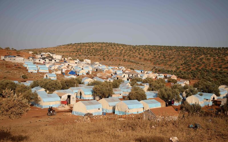 A camp for internally displaced people is pictured near Kah, in the northern Idlib province near the border with Turkey on June 3, 2019 on the eve of Eid al-Fitr, which marks the end of the Muslim holy fasting month of Ramadan. The conflict in Syria has killed more than 370,000 people and displaced millions since it started in 2011. / AFP / Aaref WATAD
