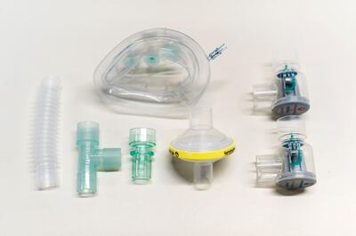 An undated handout image released by University College London (UCL) in London and received on March 30, 2020, shows components, including a mask, of the Continuous Positive Airway Pressure (CPAP) breathing aid, developed in less than a week by mechanical engineers, doctors and the Mercedes Formula 1 team in conjunction with UCL. Medical researchers and engineers at UCL have teamed up with Formula One outfit Mercedes to adapt a breathing aid for mass production that could keep coronavirus patients off much-needed ventilators. 
University College London said UK regulators had approved its adaptation of the continuous positive airway pressure device (CPAP), which helps patients with breathing difficulties. A version of the equipment, which increases air and oxygen flow into the lungs, has already been used in hospitals in Italy and China to help COVID-19 patients with serious lung infections. - RESTRICTED TO EDITORIAL USE - MANDATORY CREDIT "AFP PHOTO / James Tye/ UCL / Handout " - NO MARKETING - NO ADVERTISING CAMPAIGNS - DISTRIBUTED AS A SERVICE TO CLIENTS
 / AFP / University College London (UCL) / James Tye / RESTRICTED TO EDITORIAL USE - MANDATORY CREDIT "AFP PHOTO / James Tye/ UCL / Handout " - NO MARKETING - NO ADVERTISING CAMPAIGNS - DISTRIBUTED AS A SERVICE TO CLIENTS
