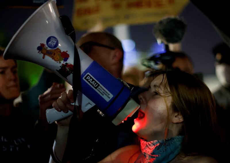 An anti-abortion protester speaks outside the US Supreme Court after the leak of a draft majority opinion written by Justice Samuel Alito preparing for the court to overturn the Roe v  Wade abortion rights decision later this year. Reuters