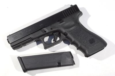 MIAMI, FL - DECEMBER 18: In this photo illustration, a Glock pistol with a 17 round magazine is seen on December 18, 2012 in Miami, Florida. The weapon is the same type that was used during a massacre at an elementary school in Newtown, Connecticut. Firearm sales have surged recently as speculation of stricter gun laws and a re-instatement of the assault weapons ban following the mass shooting. (Photo illustration by Joe Raedle/Getty Images/AFP