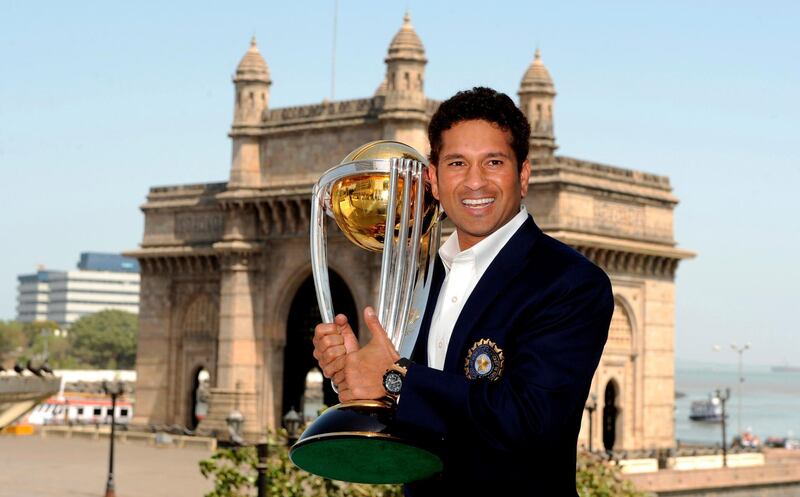 Sachin Tendulkar with the 2011 World Cup trophy in Mumbai. Reuters