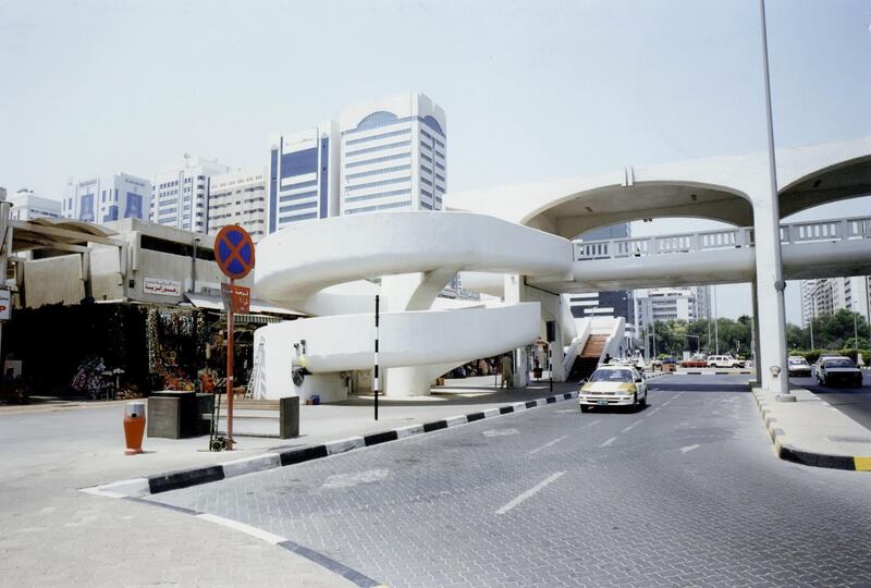 The spiral walkways to the pedestrian bridge across Khalifa bin Zayed Street in the 1990s. The Abu Dhabi souq stretched across both sides. The World Trade Centre stands on the same site today along with Burj Mohammed bin Rashid - Abu Dhabi's tallest building. Courtesy: Al Ittihad