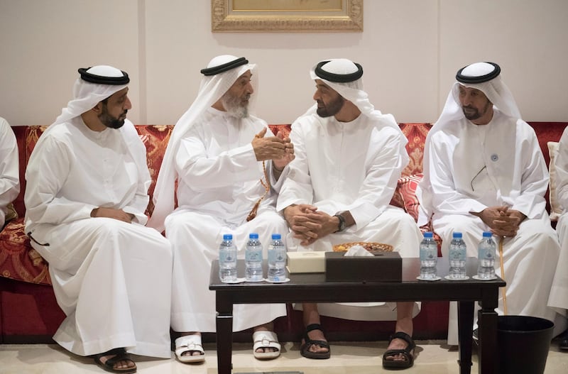 ABU DHABI, UNITED ARAB EMIRATES - July 02, 2018: HH Sheikh Mohamed bin Zayed Al Nahyan Crown Prince of Abu Dhabi Deputy Supreme Commander of the UAE Armed Forces (2nd R) offers condolences to the family of the late Mubarak bin Garran Al Mansouri. Seen with HE Hamad bin Suhail Al Khaili (R).

( Hamad Al Kaabi / Crown Prince Court - Abu Dhabi )
---