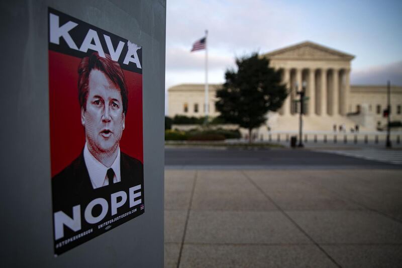 A sticker in protest of Brett Kavanaugh, U.S. Supreme Court associate justice nominee for U.S. President Donald Trump, is seen outside of the U.S. Supreme Court building in Washington, D.C., U.S., on Friday, Sept. 21, 2018. Christine Blasey Ford, the woman who's accused Kavanaugh of sexual assault, has agreed to testify before a Senate panel, her lawyers said in an email to staff of the Senate Judiciary Committee. Photographer: Al Drago/Bloomberg