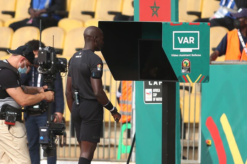 Referee Maguette Ndiaye checks VAR for the early penalty decision. EPA