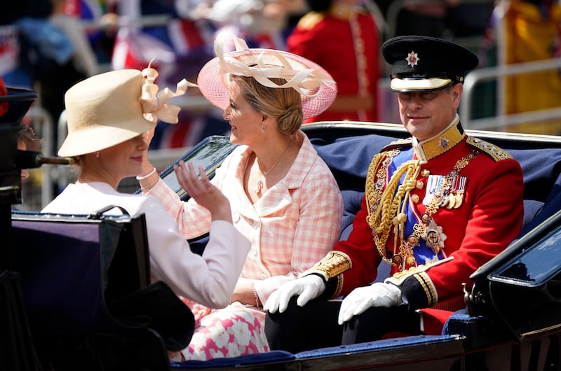 Prince Edward and his wife Sophie, Countess of Wessex ride in a carriage as the Royal Procession leaves Buckingham Palace for the Trooping the Color ceremony. AP