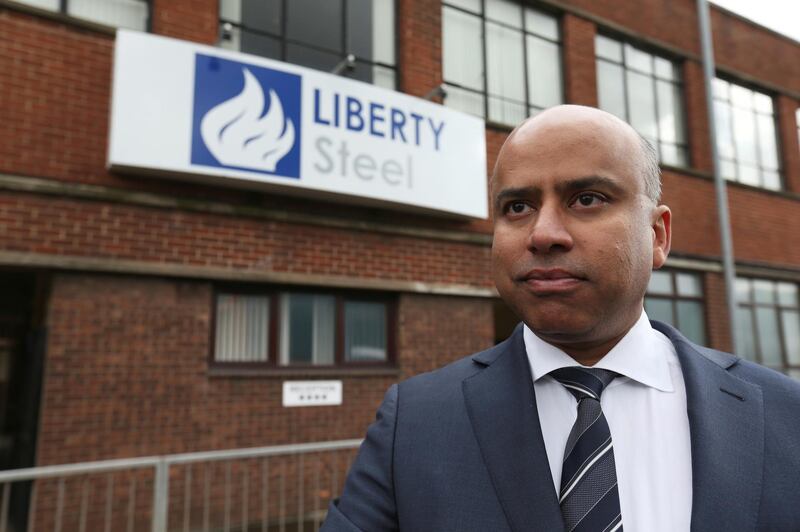 FILE PHOTO: Liberty Steel boss Sanjeev Gupta stands outside steel pressing mill in Dalzell after completing its purchase, Scotland, Britain April 8, 2016. REUTERS/Russell Cheyne/File Photo