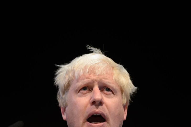 (FILES) In this file photo taken on September 29, 2014 Mayor of London Boris Johnson addresses delegates at a fringe meeting on the second day of the annual British Conservative Party conference in Birmingham, central England, on September 29, 2014.   At different times described as a "straw-coloured mop", "eccentrically windblown" and resembling a "mediaeval monk", Boris Johnson's talismanic haircut has helped define a political career that has now led to Downing Street. / AFP / LEON NEAL / TO GO WITH AFP STORY BY JAMES PHEBY
