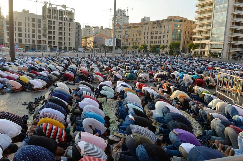 Muslims perform Eid Al Adha prayers in front of the Muhammad al-Amin Mosque in downtown Beirut, Lebanon. EPA