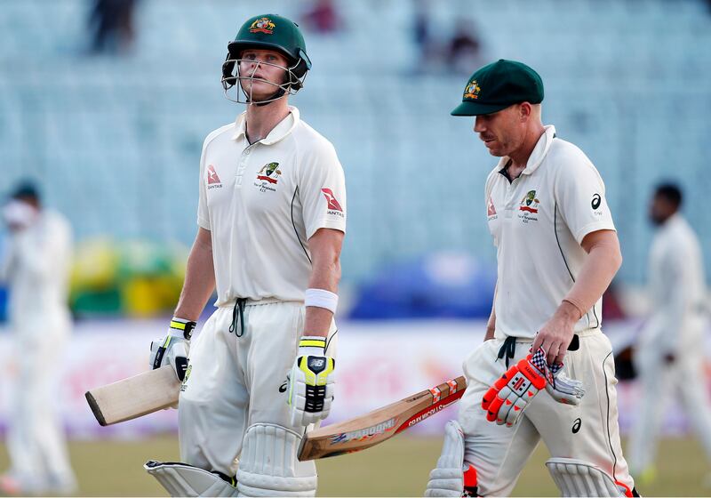 Australian cricket team captain Steve Smith, left, and his teammate David Warner leave the ground after end of the third day of the first test cricket match against Bangladesh in Dhaka, Bangladesh, Tuesday, Aug. 29, 2017. (AP Photo/A.M. Ahad)