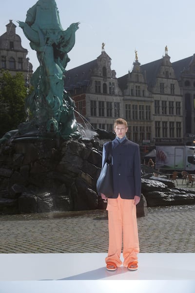 At Dries Van Noten, extra-long trousers puddle on shoes for spring / summer 2022. Courtesy Dries Van Noten