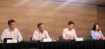 FILE PHOTO: Members of the multi-ministry taskforce, Director of Medical Services at the Ministry of Health Kenneth Mark, Minister of Health Gan Kim Yong, Minister of National Development Lawrence Wong and Liew Wei Li, Director of Schools, Ministry of Education, give a news conference after raising the coronavirus outbreak alert to Orange in Singapore, February 7, 2020. REUTERS/Aradhana Aravindan/File Photo