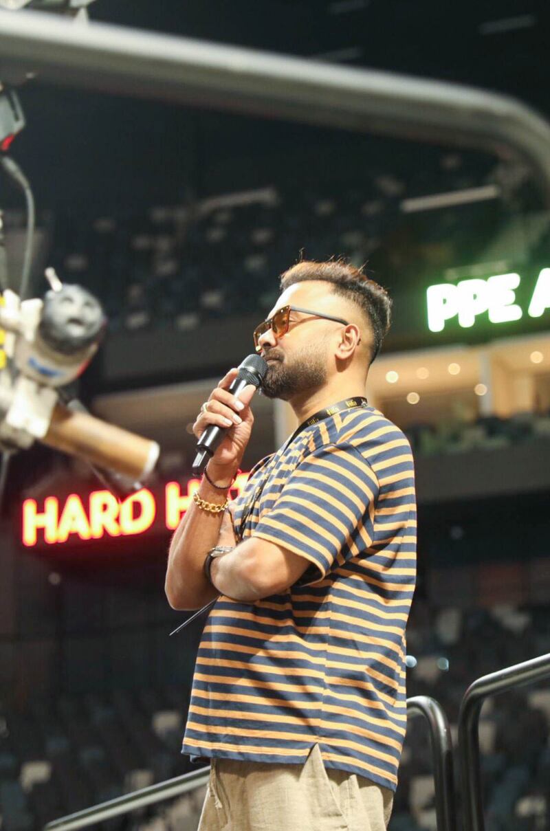 Bollywood choreographer Sanjay Shetty supervises rehearsals at the Etihad Arena.