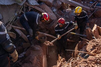 Search and rescue workers dig through the rubble of a collapsed house in Ouirgane, Morocco. Getty Images