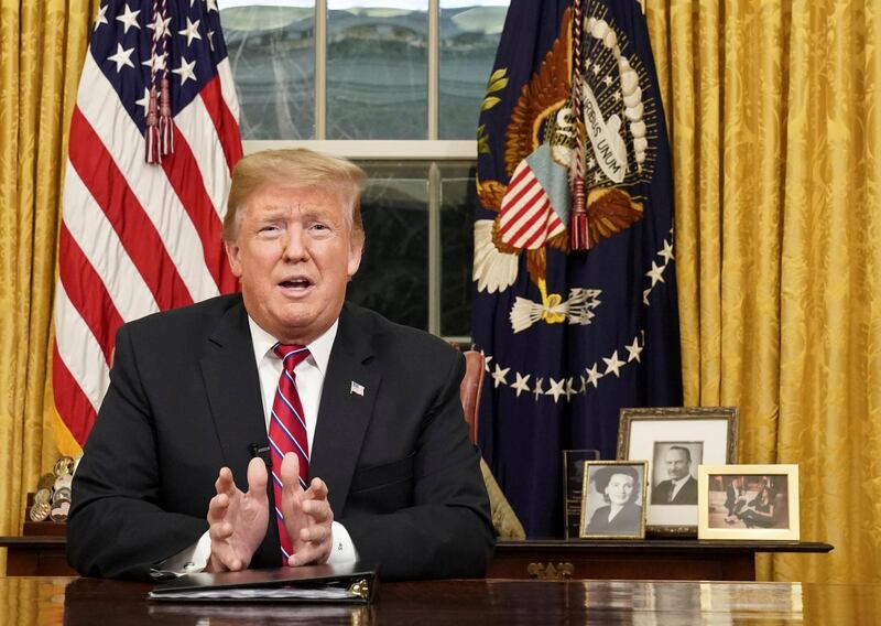 U.S. President Donald Trump delivers a televised address to the nation from his desk in the Oval Office about immigration and the southern U.S. border on the 18th day of a partial government shutdown at the White House in Washington, U.S., January 8, 2019. REUTERS/Carlos Barria     TPX IMAGES OF THE DAY
